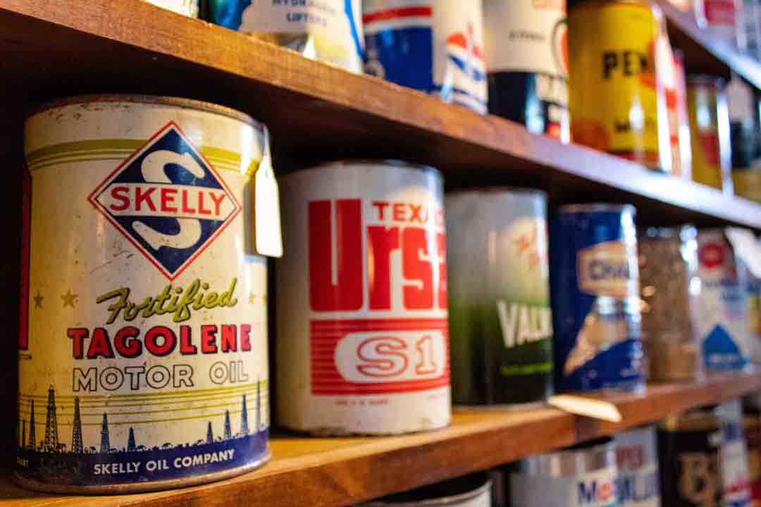 Old paint cans on a shelf