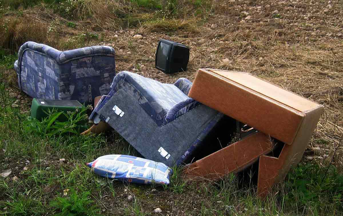 dumped furniture in a field